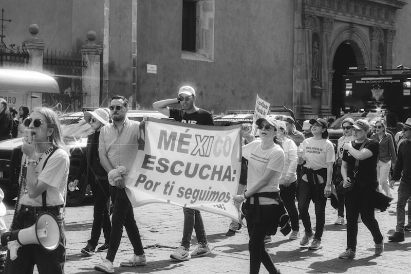 A group of people marching down a street