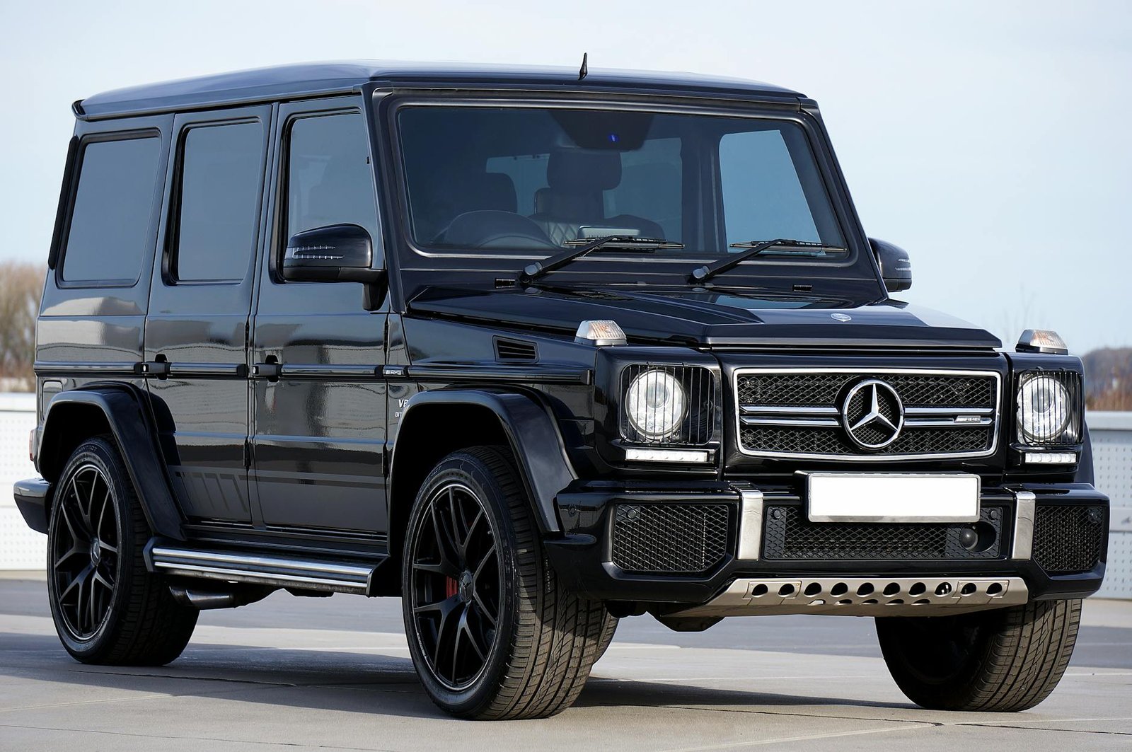 Sleek black Mercedes G-Class SUV parked outdoors, showcasing luxury design and power.