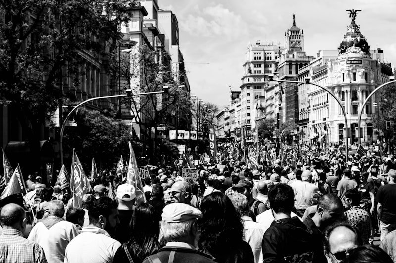 grayscale photo of people walking on street