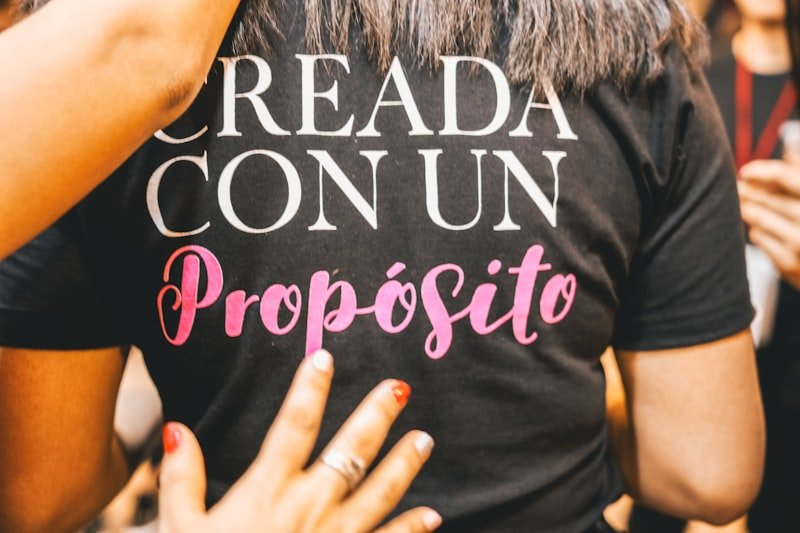 woman wearing black, white, and pink shirt