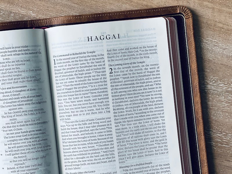 An open bible displays the book of haggai.