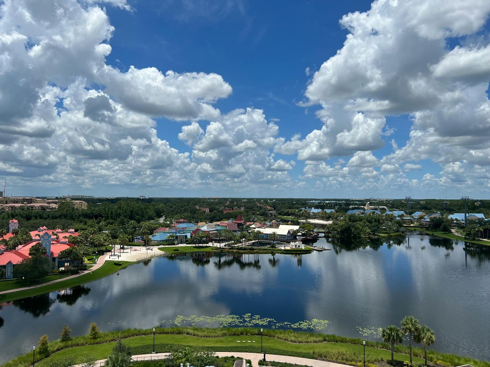 Aerial view of a scenic resort in Lake Buena Vista, Florida, with waterfront and lush landscape.