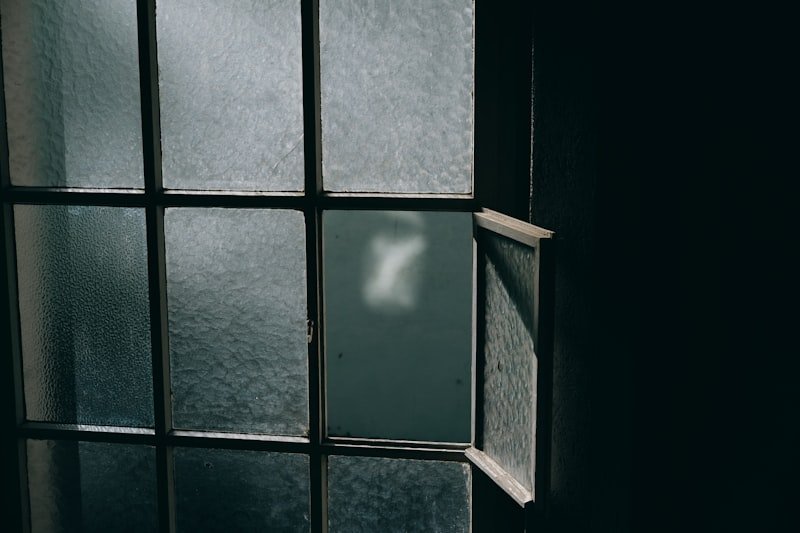 black metal framed glass window