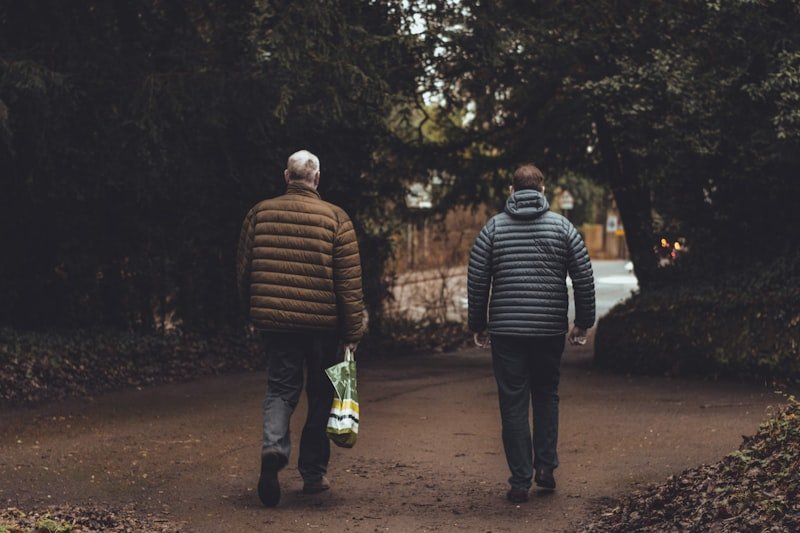 two men walking along the road