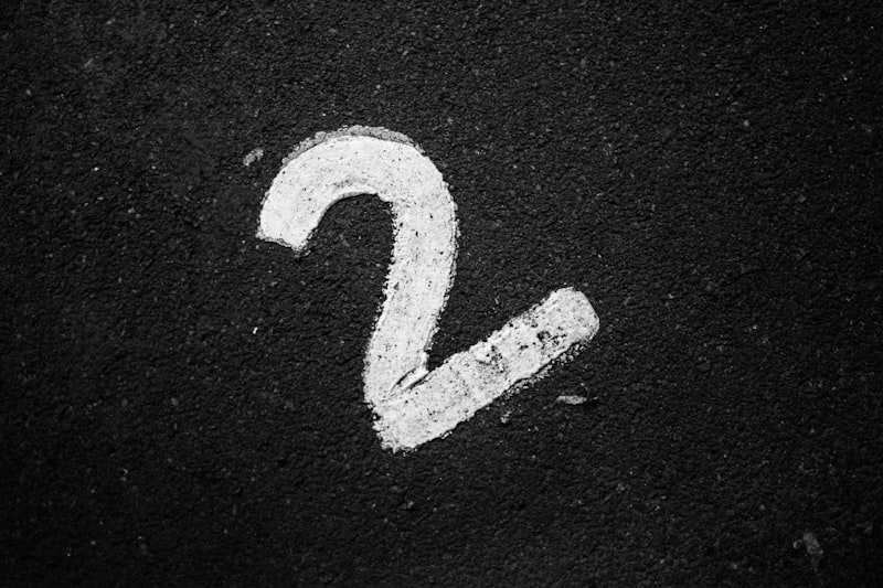 a close up of a street sign on the ground