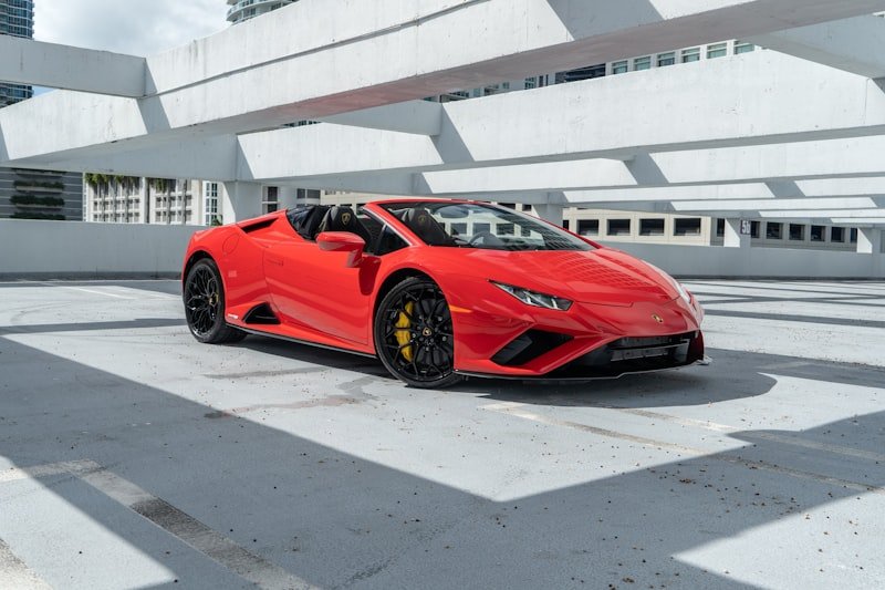 a red sports car parked in a parking lot
