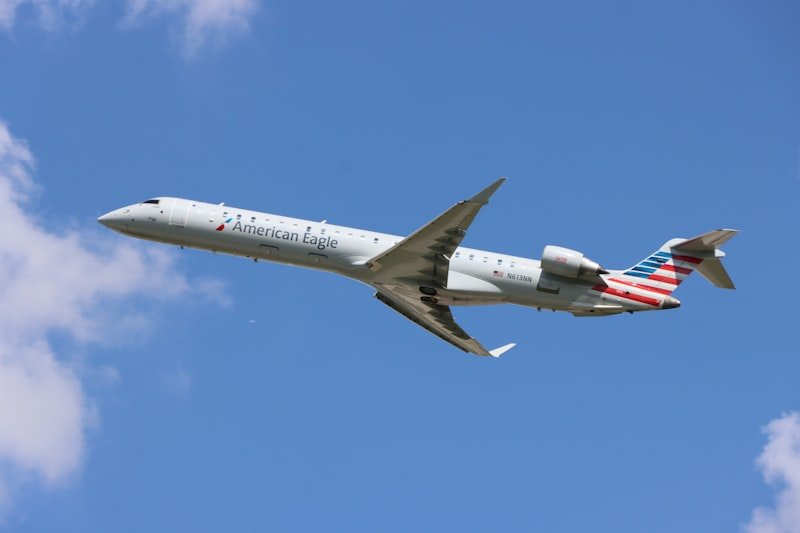 a large passenger jet flying through a blue sky