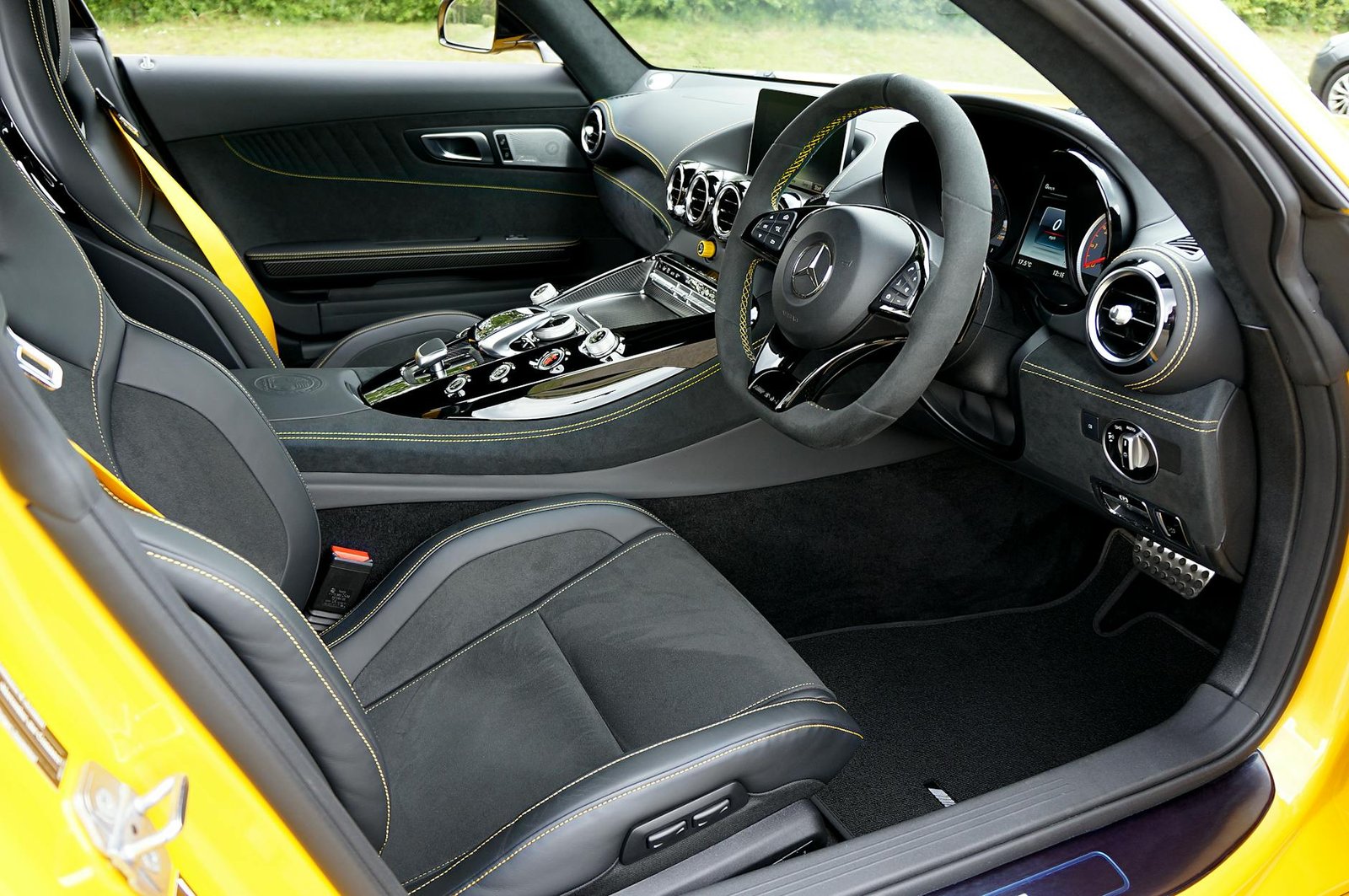 High-end sports car interior showcasing sleek leather seats and advanced dashboard features.