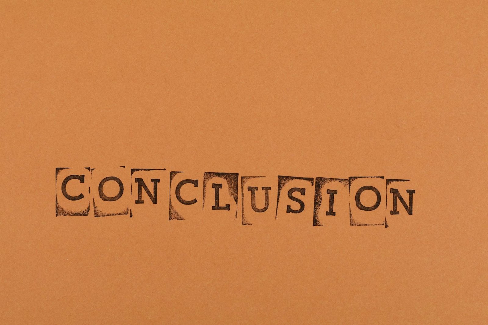 The word 'CONCLUSION' stamped with individual letters on an orange background.