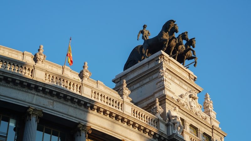 a statue of a man on a horse on top of a building