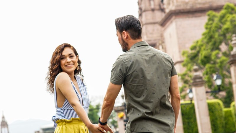 man in gray crew neck t-shirt and woman in yellow and white stripe tank top