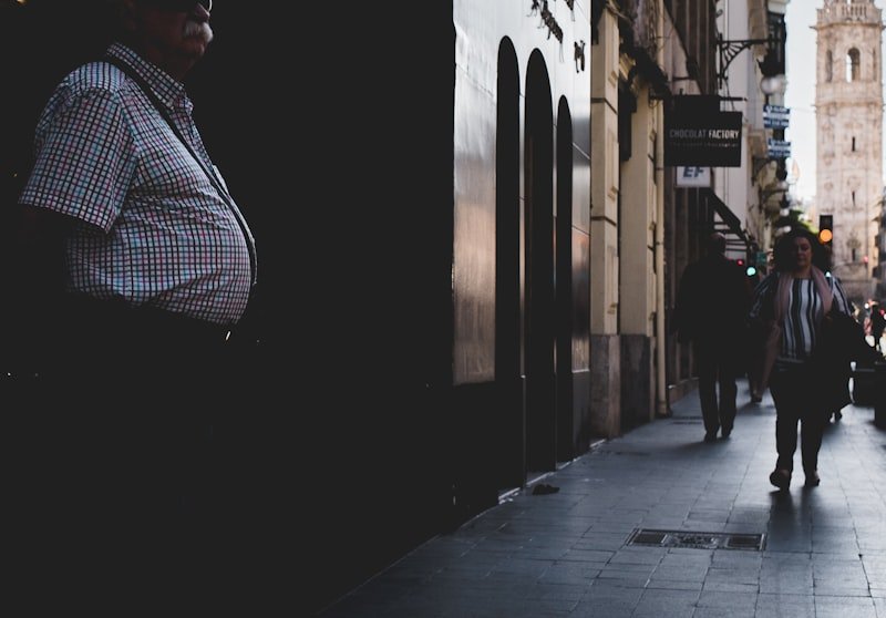 woman walking on sidewalk